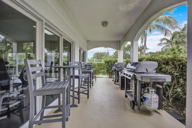 view of patio / terrace with a bar and area for grilling