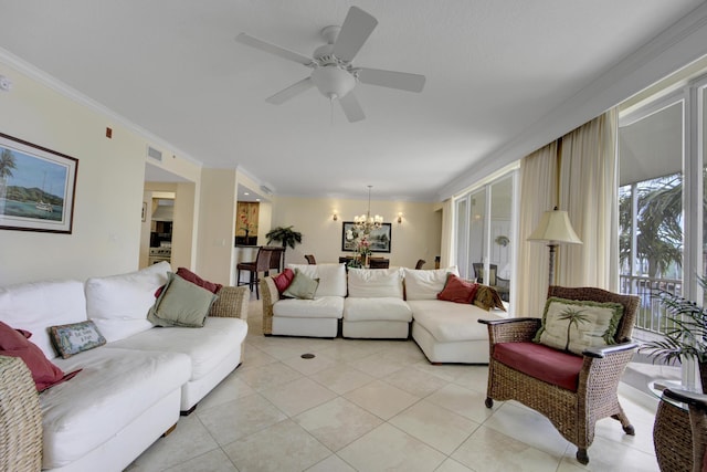 tiled living room featuring crown molding and ceiling fan with notable chandelier