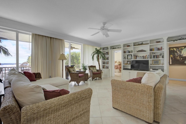 tiled living room featuring built in shelves and ceiling fan