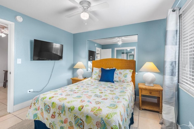 tiled bedroom with ceiling fan