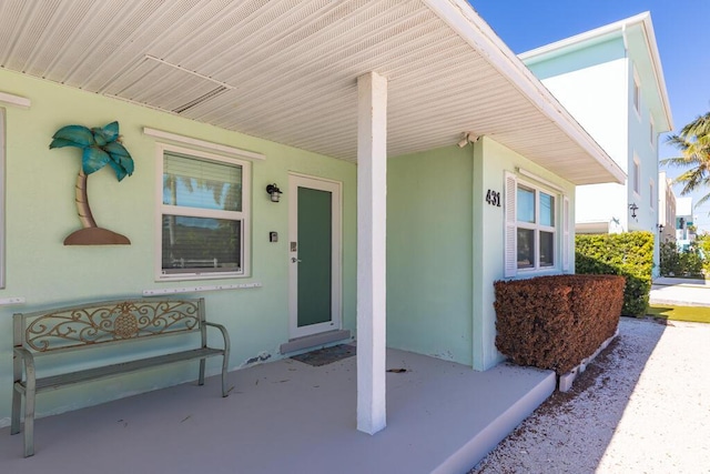 doorway to property featuring a porch