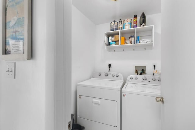 washroom featuring washer and clothes dryer