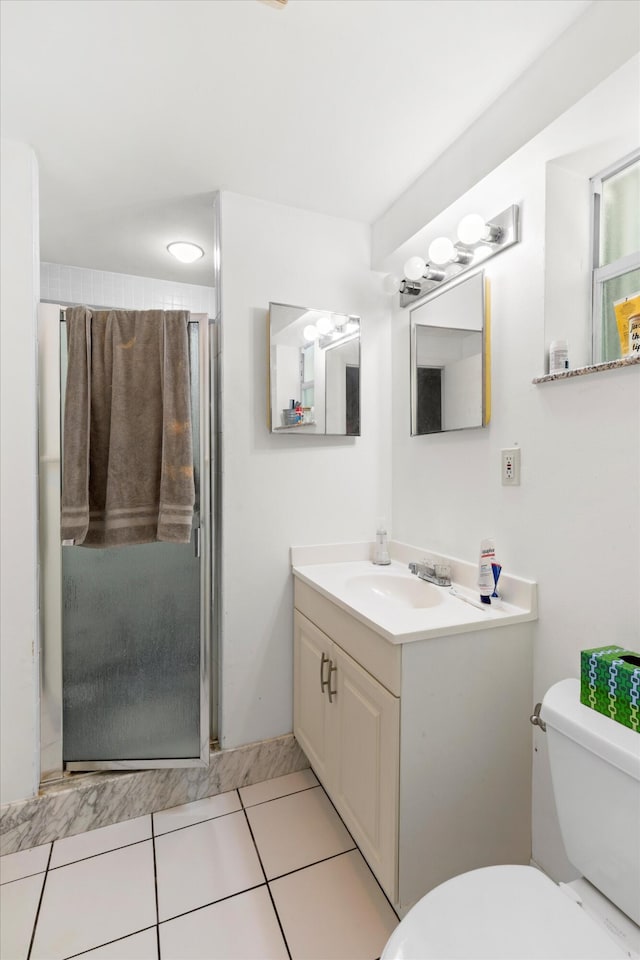 2525 Patterson Ave, Key West, FL 33040 - bathroom with toilet, a stall shower, vanity, and tile patterned floors