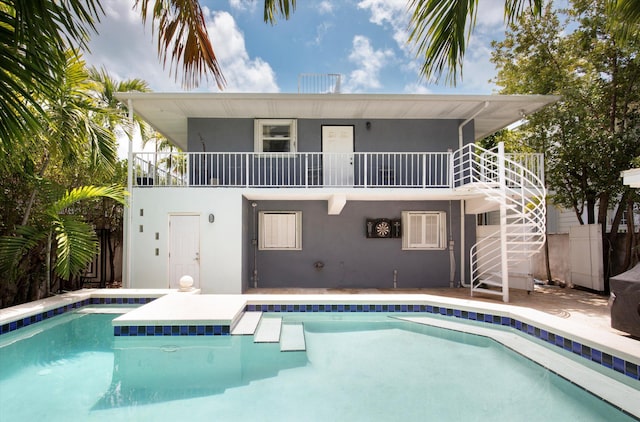 2525 Patterson Ave, Key West, FL 33040 - back of house featuring a balcony, stucco siding, and stairway