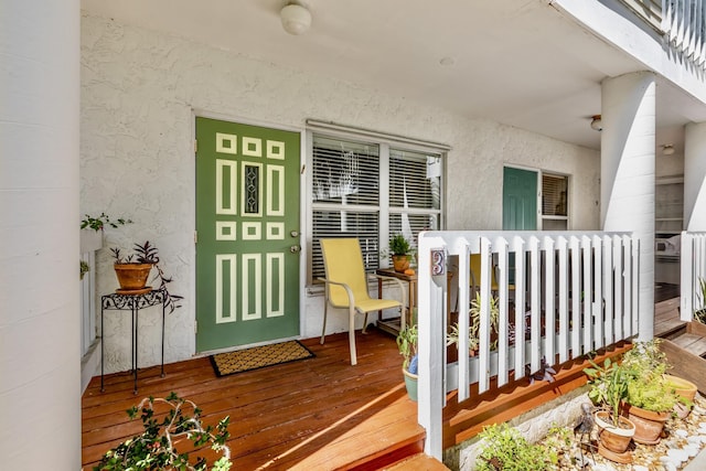 entrance to property featuring stucco siding