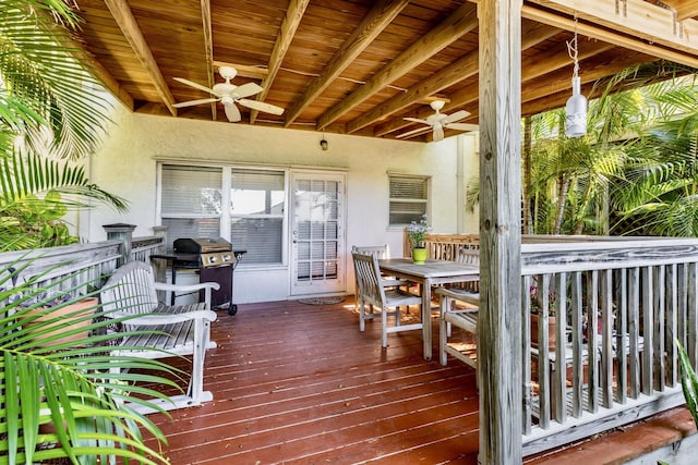 deck featuring ceiling fan, outdoor dining space, and grilling area