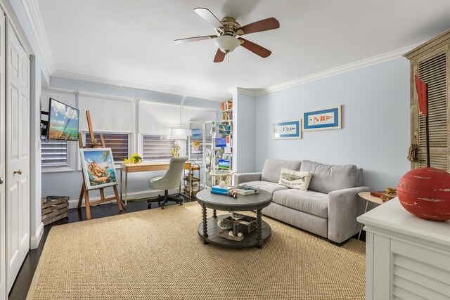 living room with crown molding, hardwood / wood-style floors, and ceiling fan