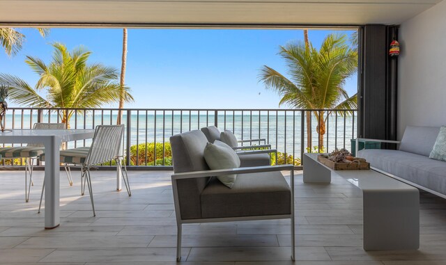 exterior space featuring a water view and a wealth of natural light