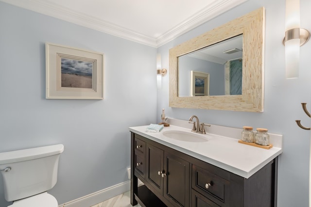 bathroom featuring ornamental molding, toilet, and vanity