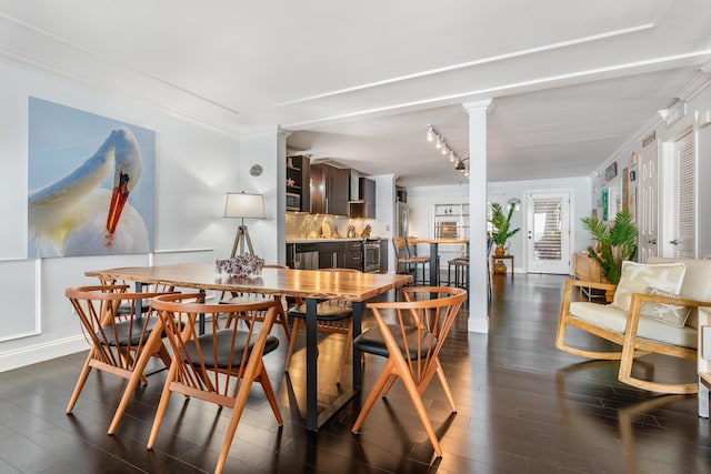 dining area featuring crown molding and dark hardwood / wood-style flooring