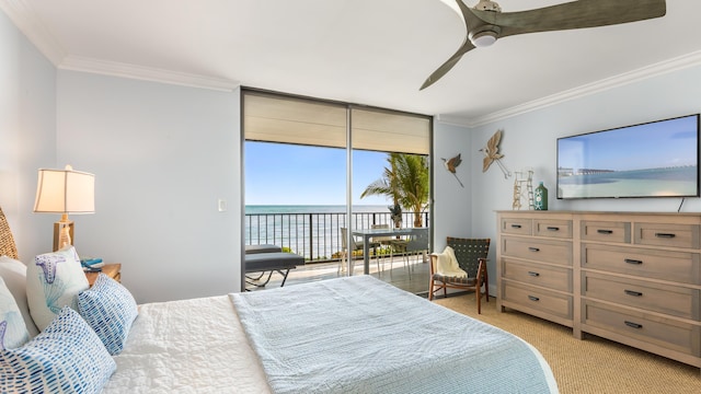 bedroom with light carpet, access to outside, ornamental molding, and expansive windows