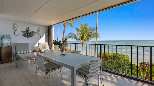 exterior space with a water view and a beach view