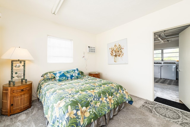 carpeted bedroom featuring a wall unit AC and washer and dryer