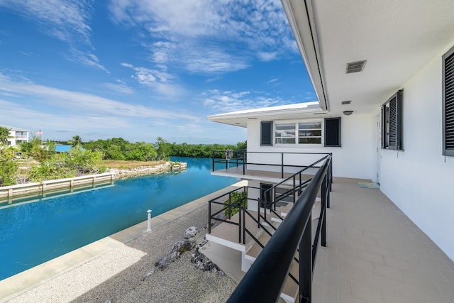 view of pool with a water view