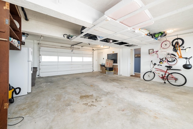 garage featuring white fridge