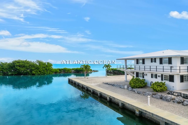 view of swimming pool with a water view