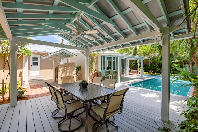1706 Seminary St, Key West, FL 33040 - wooden terrace with an outdoor pool, a ceiling fan, outdoor dining area, and a sunroom