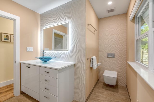 1706 Seminary St, Key West, FL 33040 - bathroom featuring wallpapered walls, vanity, and wood finished floors