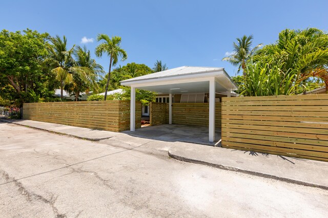 1706 Seminary St, Key West, FL 33040 - view of parking / parking lot with driveway and a detached carport