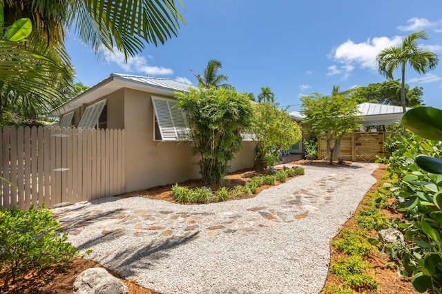 1706 Seminary St, Key West, FL 33040 - view of side of home with stucco siding, a metal roof, and a standing seam roof