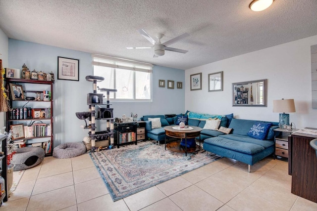 living area with light tile patterned floors, a textured ceiling, and ceiling fan