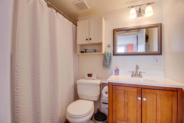 full bath with visible vents, toilet, vanity, and a shower with shower curtain