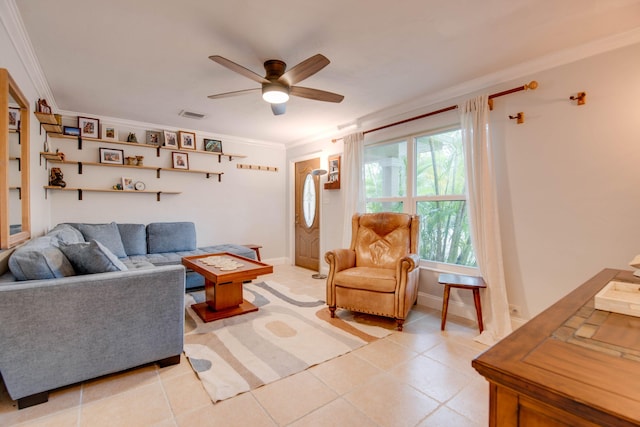 living room featuring crown molding, light tile patterned floors, visible vents, ceiling fan, and baseboards