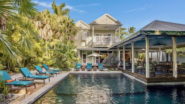 exterior space featuring ceiling fan and a patio