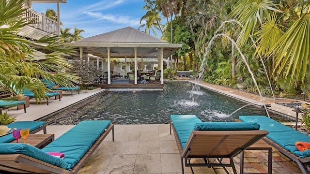 view of swimming pool featuring an outdoor living space, a patio area, and ceiling fan