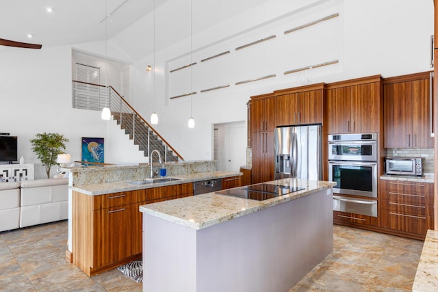 kitchen featuring high vaulted ceiling, sink, white cabinets, black appliances, and light stone countertops