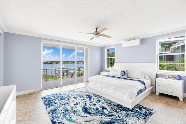 bedroom with a wall mounted air conditioner, crown molding, access to outside, and a water view