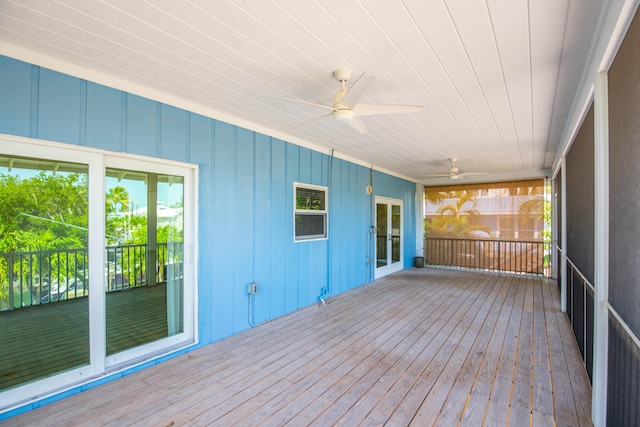 wooden deck featuring ceiling fan
