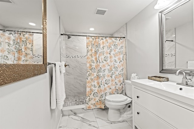 bathroom featuring vanity, toilet, and walk in shower