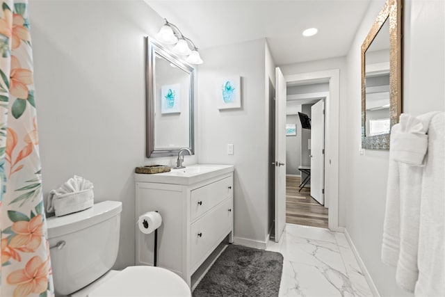 bathroom with vanity and toilet