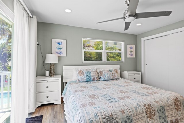 bedroom with ceiling fan and hardwood / wood-style floors