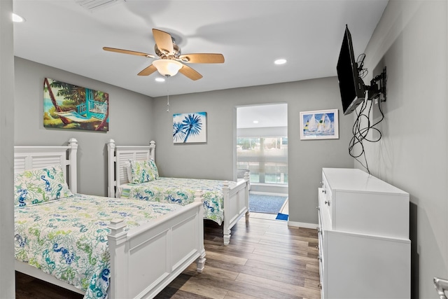 bedroom featuring wood-type flooring and ceiling fan