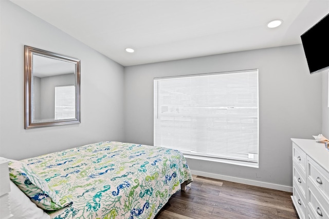 bedroom featuring dark hardwood / wood-style floors