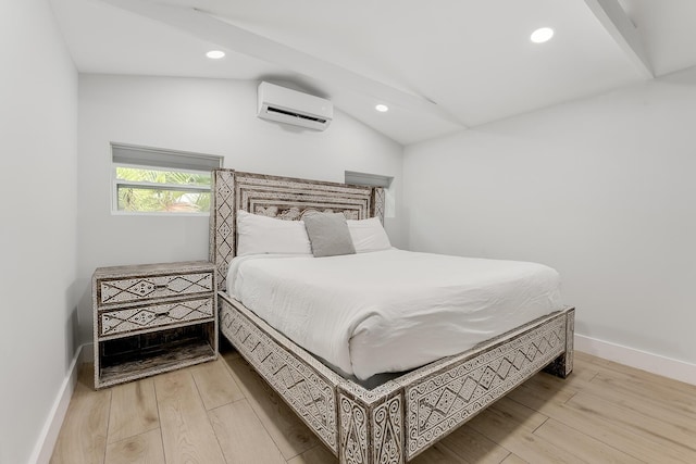 bedroom with hardwood / wood-style flooring, vaulted ceiling, and a wall mounted AC