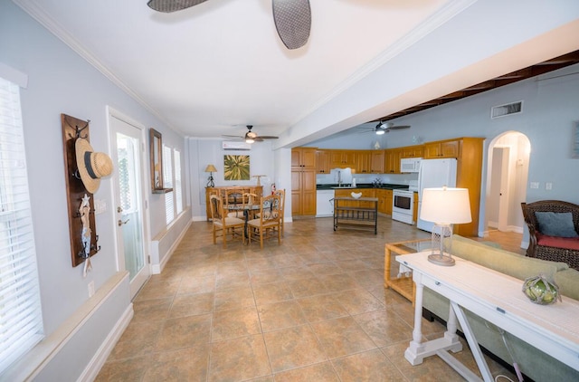 tiled living room with beam ceiling and ornamental molding