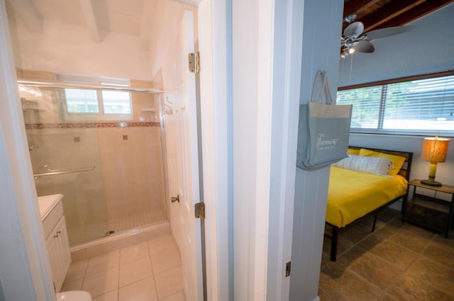 bathroom featuring vanity, tile patterned flooring, and a shower with door