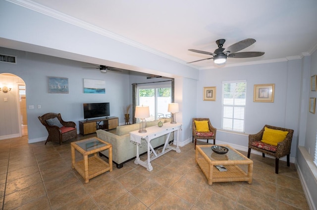 tiled living room featuring crown molding and ceiling fan