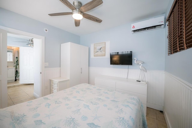 tiled bedroom featuring an AC wall unit and ceiling fan