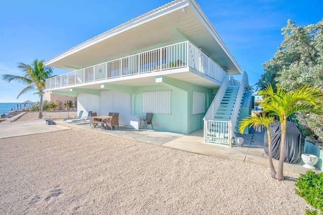 33 Kyle Way, Marathon, FL 33050 - rear view of property featuring stairway and a patio area