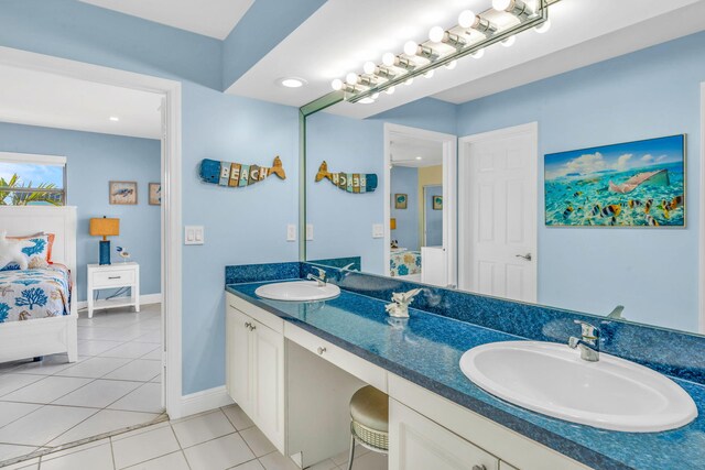 33 Kyle Way, Marathon, FL 33050 - ensuite bathroom with double vanity, tile patterned floors, and recessed lighting