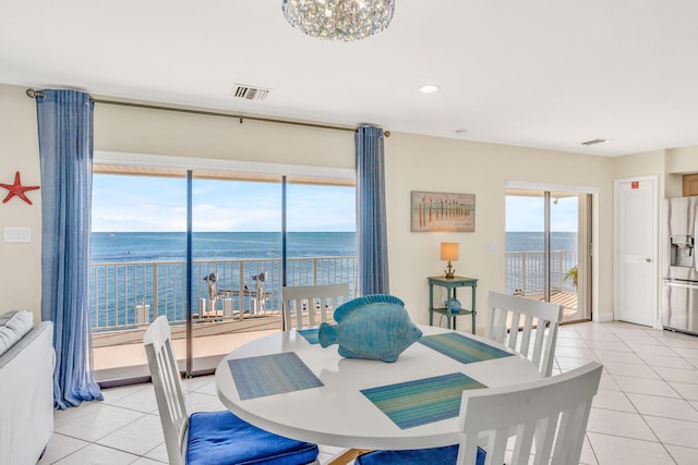 33 Kyle Way, Marathon, FL 33050 - dining space featuring light tile patterned floors, a water view, and recessed lighting
