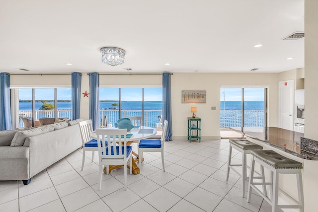 33 Kyle Way, Marathon, FL 33050 - dining room with healthy amount of natural light, a water view, light tile patterned flooring, and recessed lighting