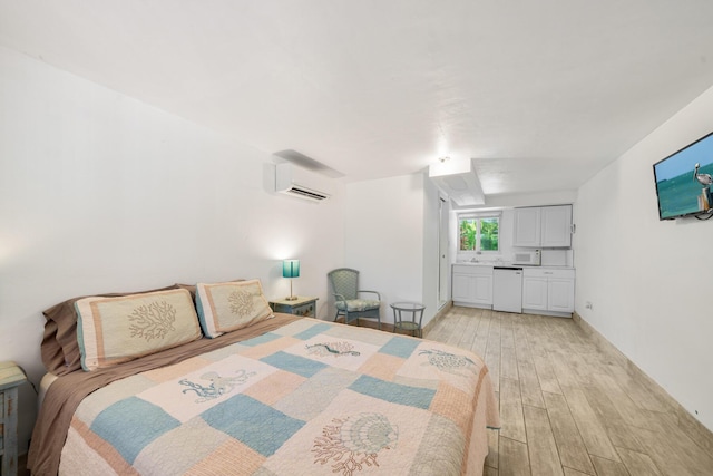 bedroom featuring a wall mounted AC and light hardwood / wood-style floors