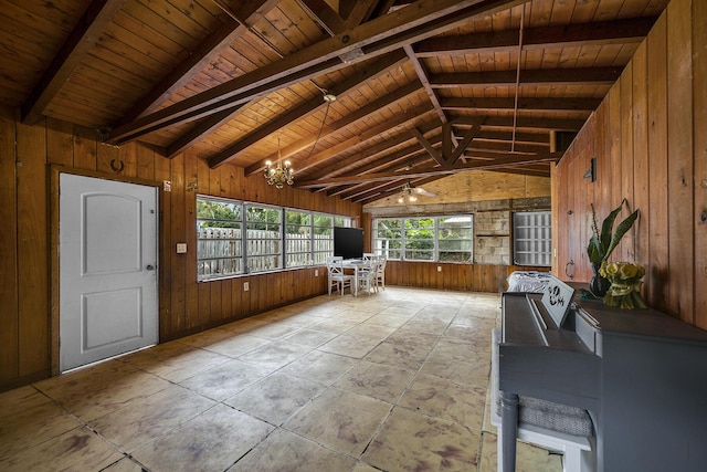 unfurnished sunroom featuring an inviting chandelier, lofted ceiling with beams, and wooden ceiling