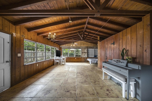 interior space with lofted ceiling with beams, wooden ceiling, and an inviting chandelier