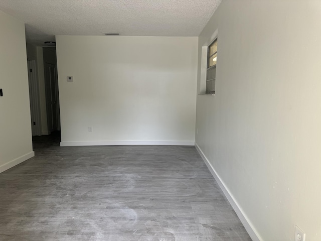 220 W Indies Rd, Tavernier, FL 33070 - spare room featuring a textured ceiling and wood finished floors